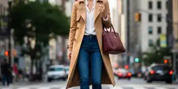 Woman wearing a classic trench coat, embodying smart wardrobe investments for 2026