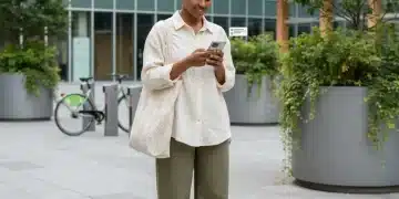 Stylish person securing limited edition sustainable collection on phone